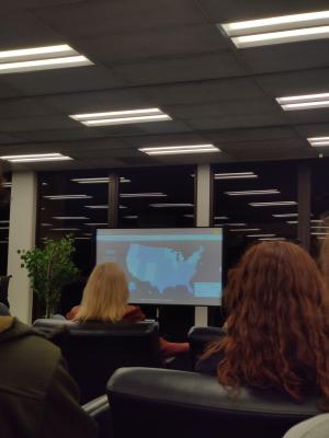 USA map on screen in front of crowd USA map on screen in front of crowd