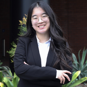 Becky Huang standing with her arms crossed