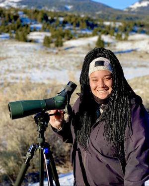 Taylor Rabe with telescope on a mountain
