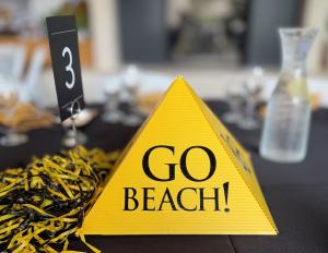Yellow pyramid with Go Beach text