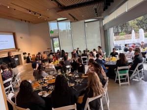 Students in the alumni center having dinner