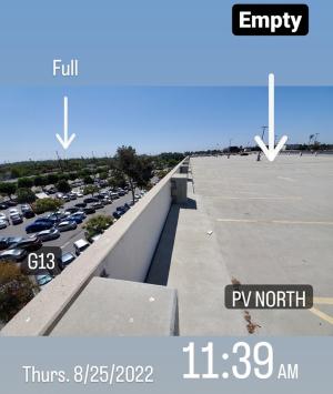 Parking structure next to surface parking lot