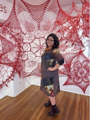 person surrounded by fabric