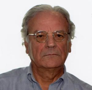 headshot of a man with glasses