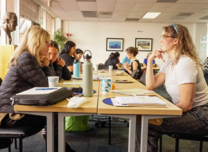 A table of community partners in conversation.