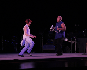 Linda Sohl-Ellison and Monty Ellison perform on stage.