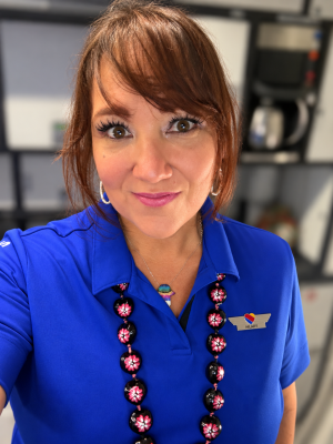 woman smiling in blue shirt