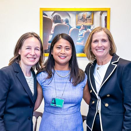Professor May Ling Halim, center, poses at the White House with event organizers