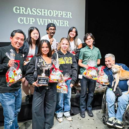 CSULB's trivia team members pose with Grasshopper Cup CSULB's Trivia Team members pose with Grasshopper Cup