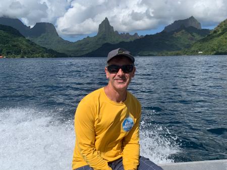 Matt Becker on boat near islands