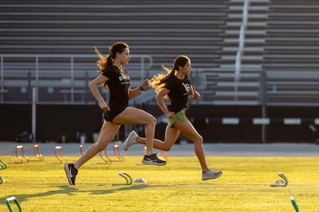 Cross Country student athletes Alyssa Tapanes and Nataly Toledo, train during a morning work-out session Cross Country student athletes Alyssa Tapanes and Nataly Toledo, train during a morning work-out session