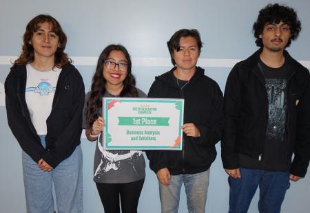 Students holding sign for first place in Business and marketing solutions