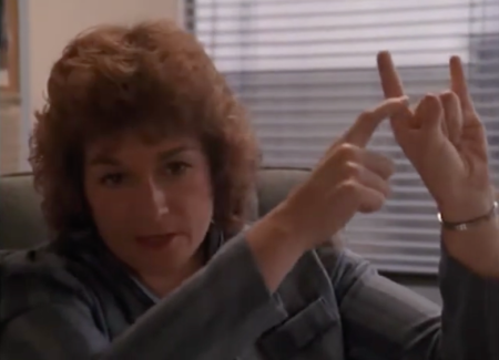 Darlyne Pettinicchio, co-founder of the parent organization Back in Control, demonstrates connections between Satanism and a commonly expressed heavy metal hand gesture. The Decline of Western Civilization, Part II: The Metal Years. Directed by Penelope Spheeris. New Line Cinema, 1988. https://www.amazon.com/dp/B00YOR8NK4. Darlyne Pettinicchio, co-founder of the parent organization Back in Control, demonstrates connections between Satanism and a commonly expressed heavy metal hand gesture. The Decline of Western Civilization, Part II: The Metal Years. Directed by Penelope Spheeris. New Line Cinema, 1988. https://www.amazon.com/dp/B00YOR8NK4.