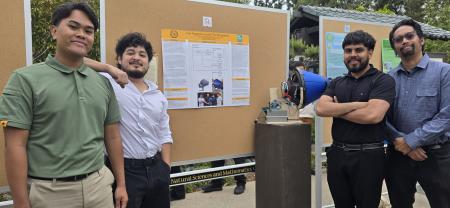 A group of students standing in front of their sustainability project