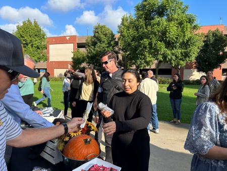Staff enjoying breakfast by the College of Business