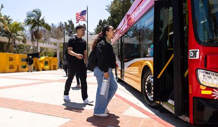 Students boarding a city bus
