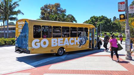 Students boarding a campus shuttle