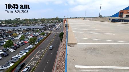 Parking structure next to surface parking lot
