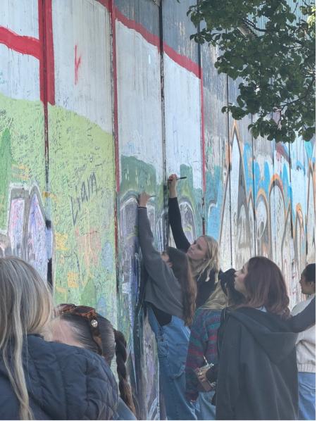 1CSULB students on a study-abroad trip to Ireland sign a peace wall in Belfast. Walls were built to mitigate violence between nationalist Catholic and unionist Protestant areas.