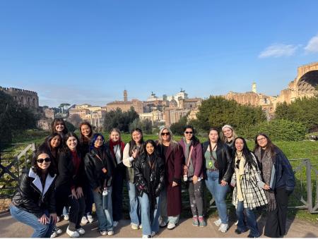 Students pose at the Roman Forum during a College of Education trip to Italy.