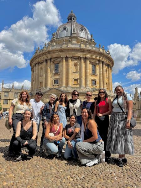 Members of this year's study abroad group pose in front of The Sheldonian Theatre in Oxford, England.