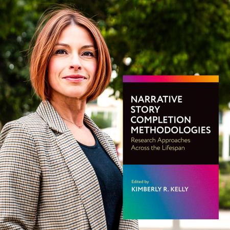Kimberly R. Kelly CSULB book Kimberly R. Kelly stands beside a book titled Narrative Story Completion Methodologies