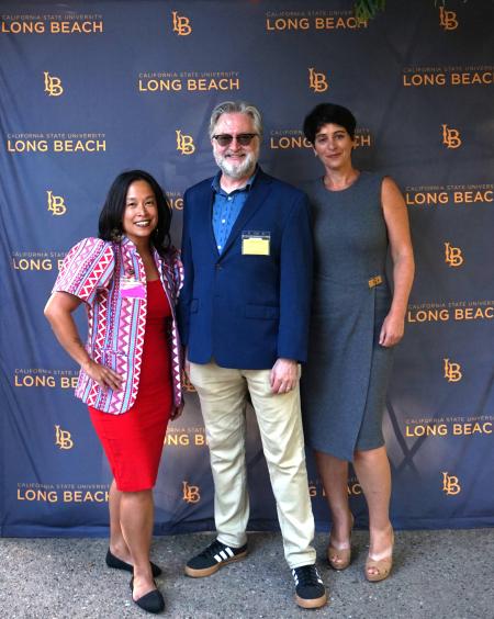 photo of 3 people posing 