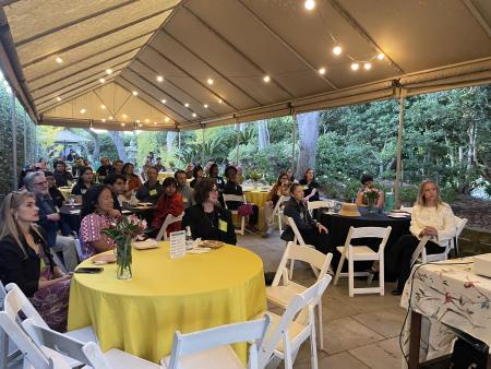 group of people sitting down at tables