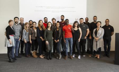 a group of people smiling at the camera