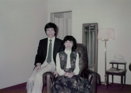 Two people sit in a chair together