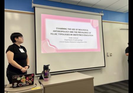 MA candidate presenting academic research.