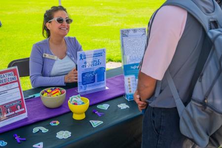 Safer staff at a booth.