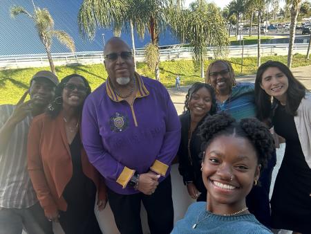 CSULB Village community liaisons taking a photo together,
