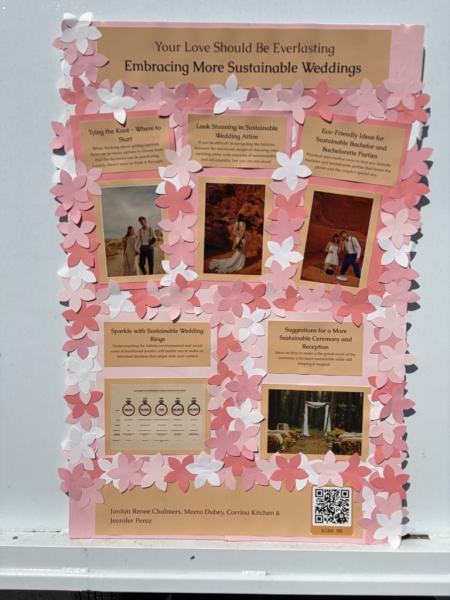 A poster board with white and pink flowers