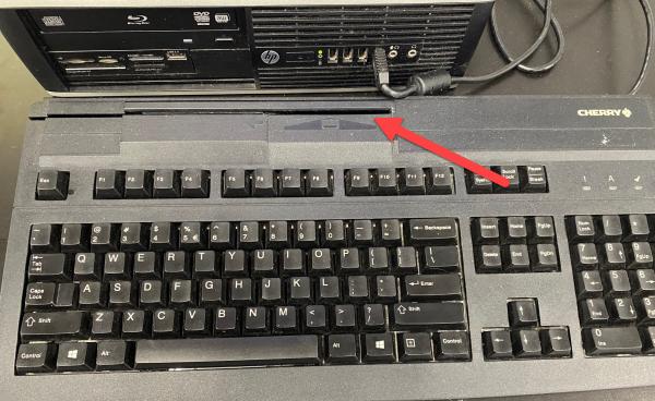 printer keyboard with red arrow to ID slide slot