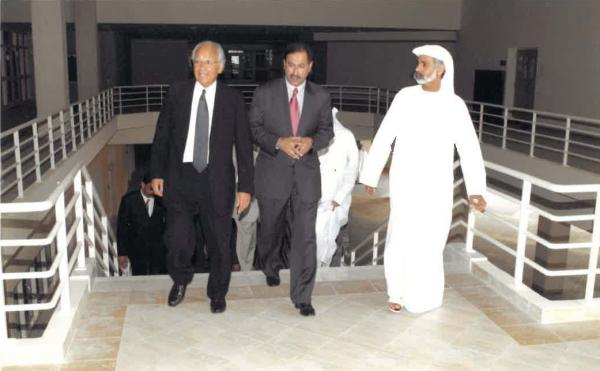 Bill Vega walks with colleagues at Dubai Men's College