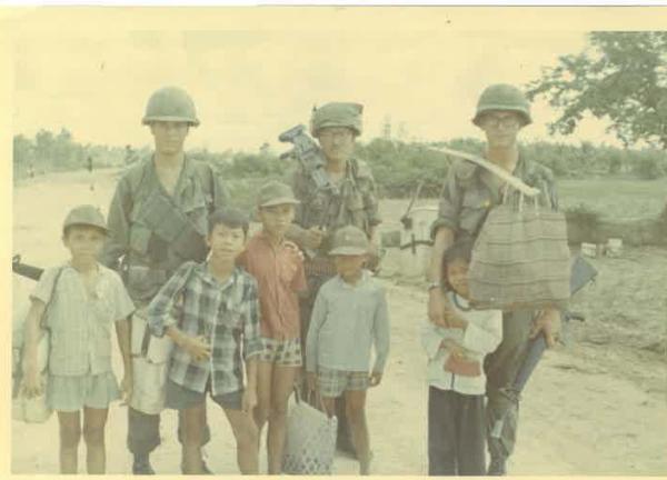 Vega, middle, during a routine patrol in and around Dong Tam base camp in Vietnam.