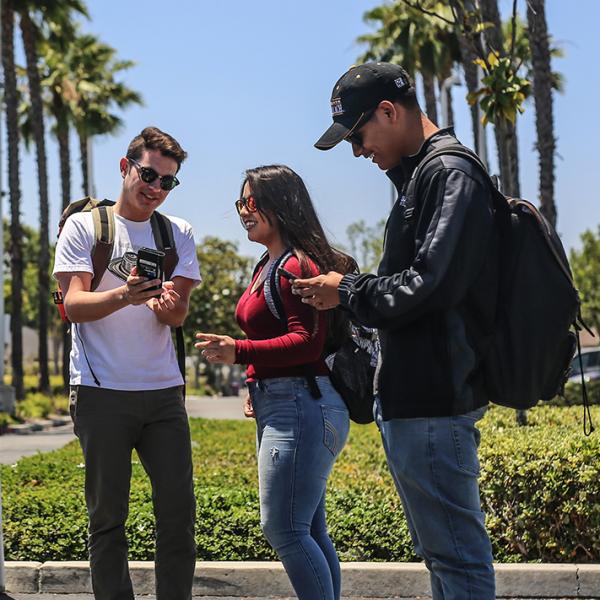 Students using their cellphones.