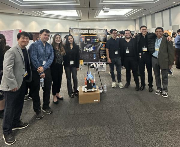 Sharkus Electrus with Winning Poster Kang Mendez