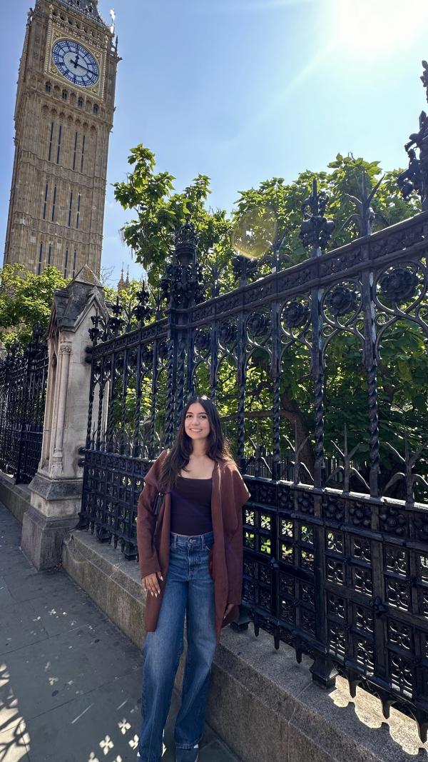 Priya standing next to Big Ben clocktower