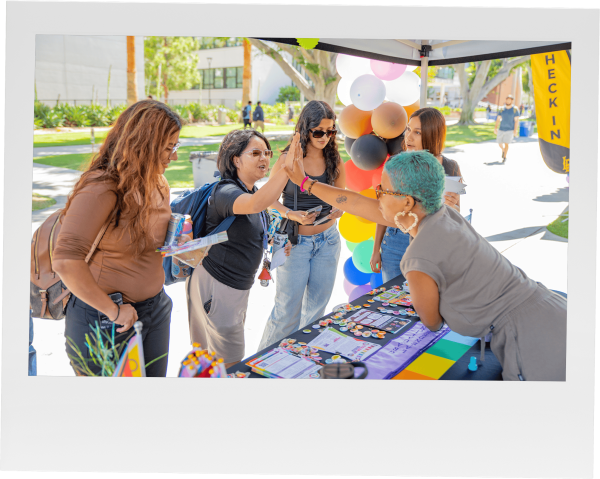 Student at the LGBTQ resource center's booth.