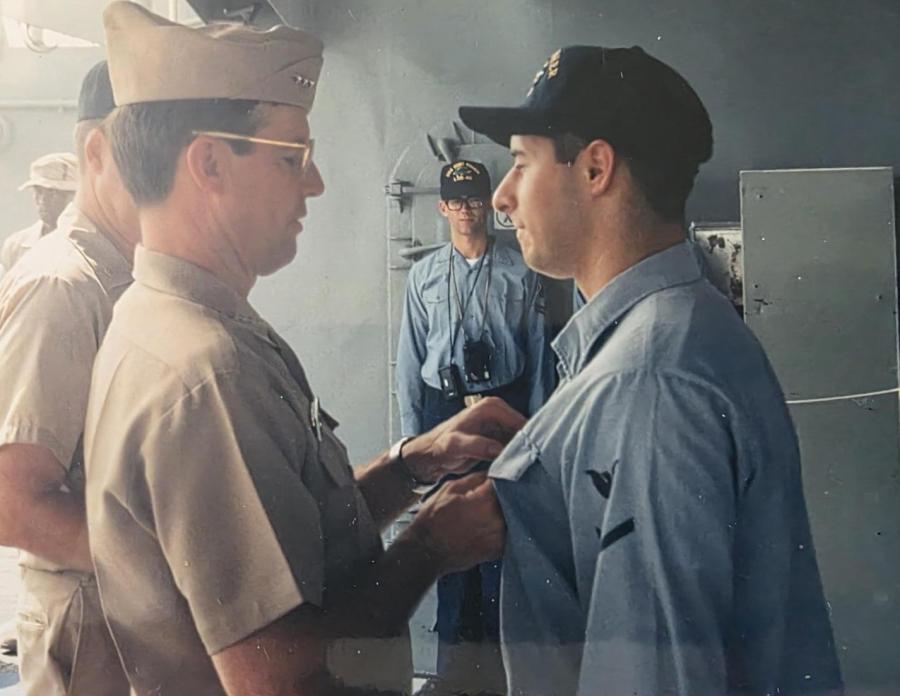 Dan Montoya, right, receiving a Navy achievement medal during his service 