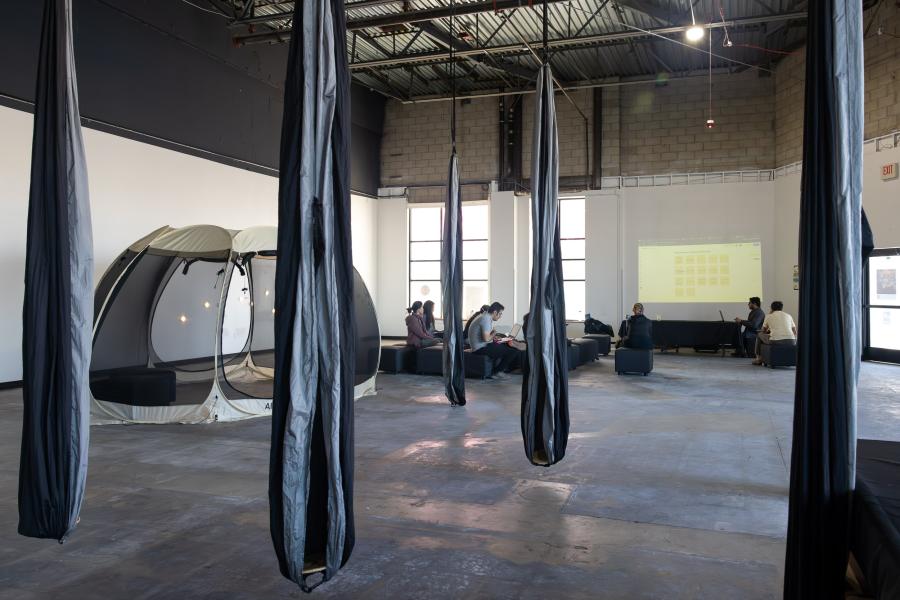 Inside the Immersive Design Research Lab as students discuss work