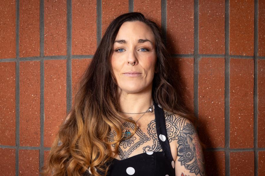 Taryn Williams against a brick wall