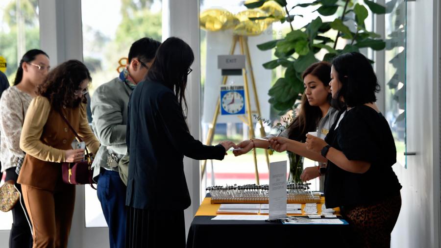 Attendees Checking in at Senior Send-Off Event