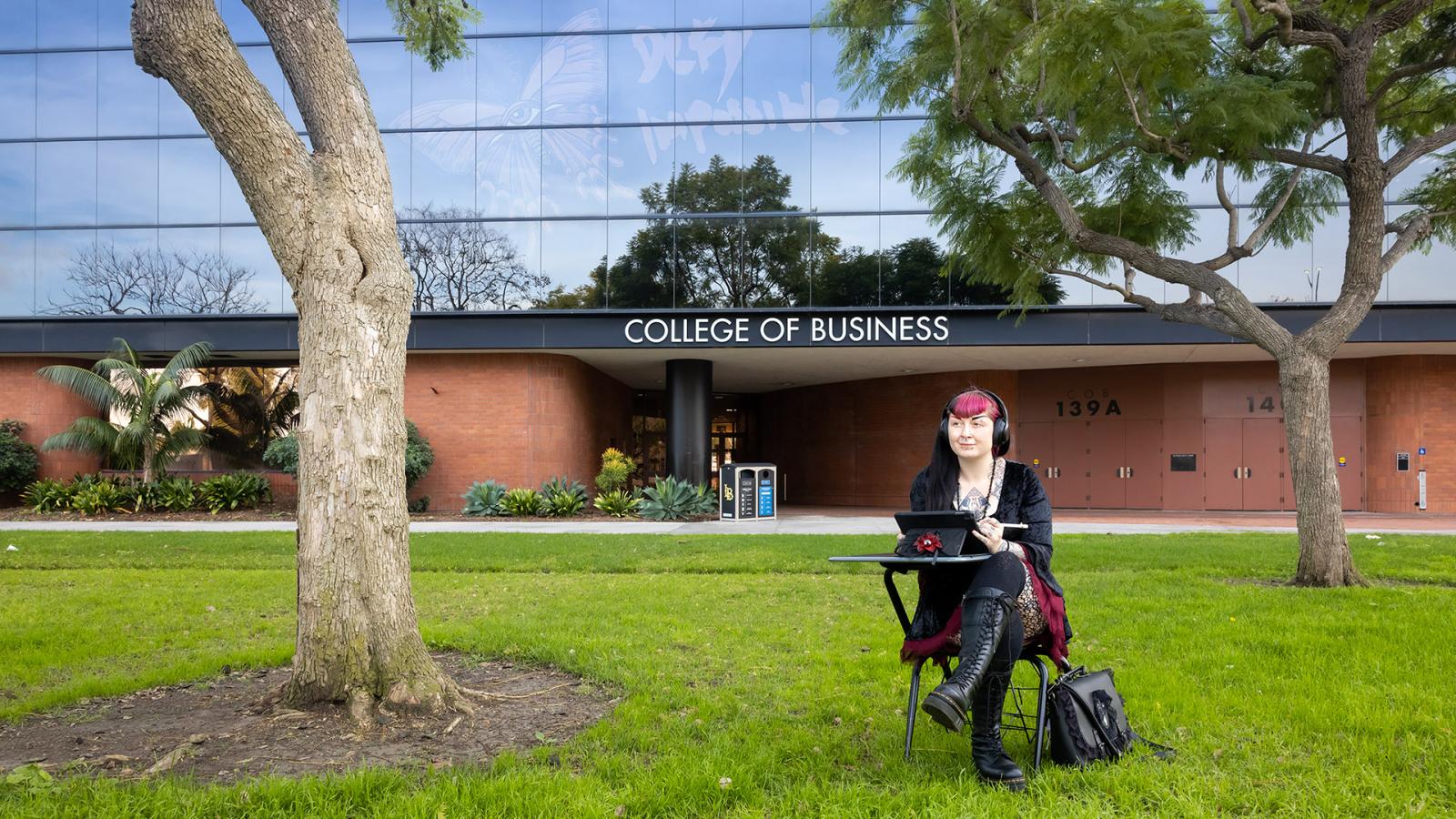 Student Laura Bush works on computer in front of COB