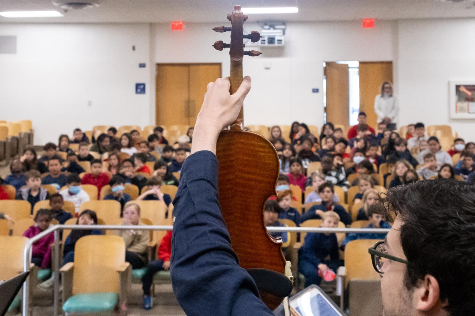 Giancarlo Latta shows off his violin