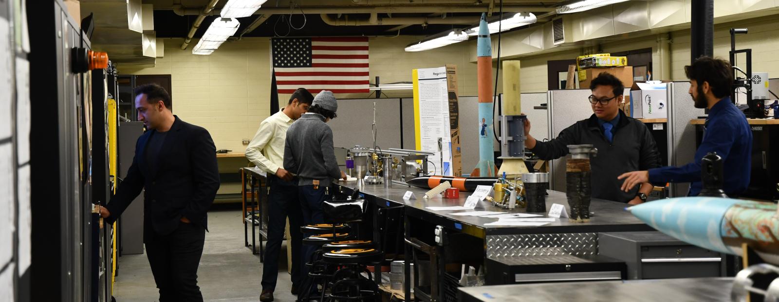 Students from CSULB Rocket Lab display their rockeets