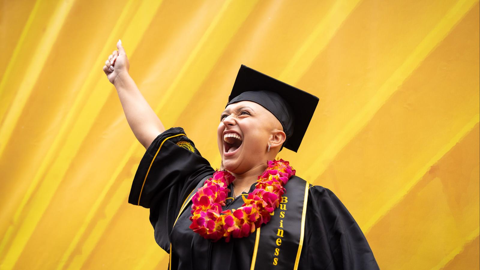 Grad raises index finger in celebration