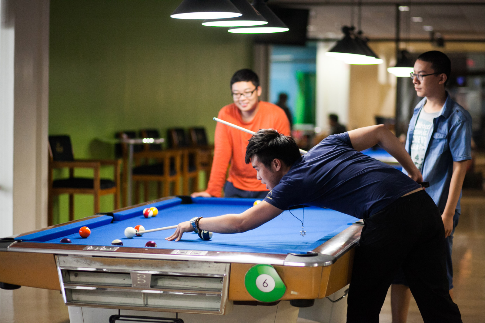 Students playing pool at the Games Center Students playing pool at the Games Center